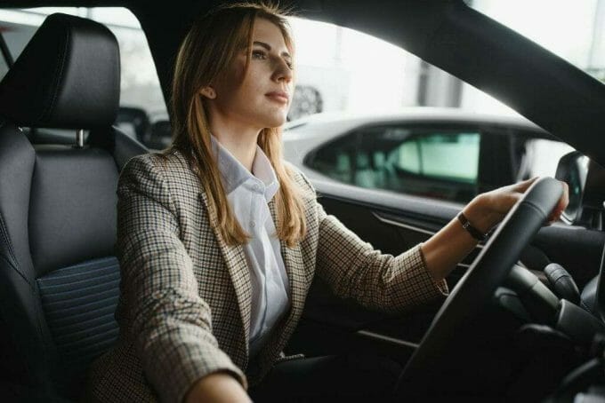 Woman in a personal car with a driver monitoring system