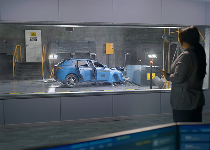 A blue car being submitted to a crash test.