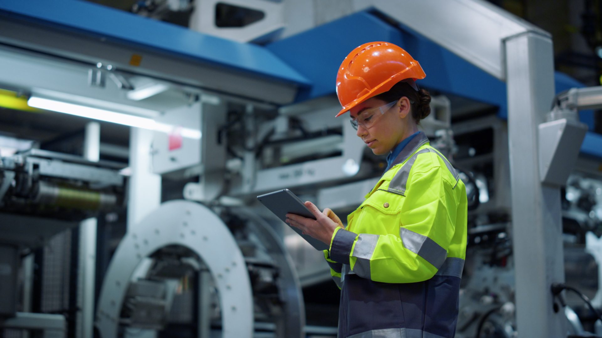 Engineer looking tablet computer in energy company